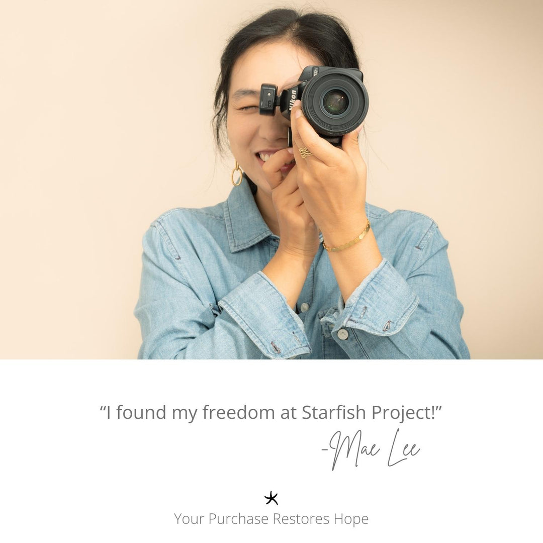 Photo of a photographer, woman holding a camera, symbol of starfish, career development, handcrafted jewellery, quality jewellery