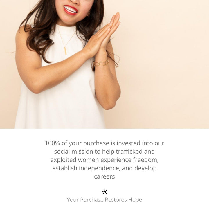 Photo of woman clapping and wearing high quality gold jewellery, golds, women's artisan jewellery, jewellery company, freedom organization