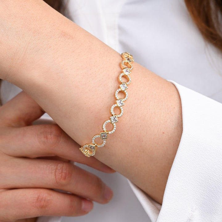 A woman wearing beautiful high quality gold jewellery, zircon stone and gold bracelets, jewellery brands