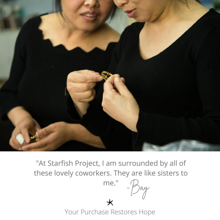 Photo of women admiring and creating a beautiful gold bracelet, handmade jewellery, Starfish Project symbolism, symbol of hope, fair trade artisan jewellery