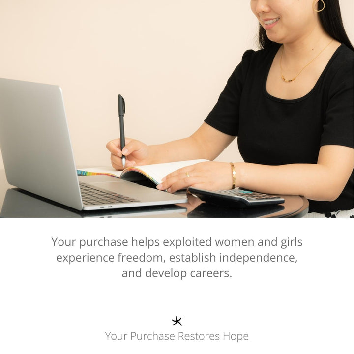 Photo of woman working on a laptop, career development, symbolism for hope, artisan jewellery, Starfish Project, jewellery company